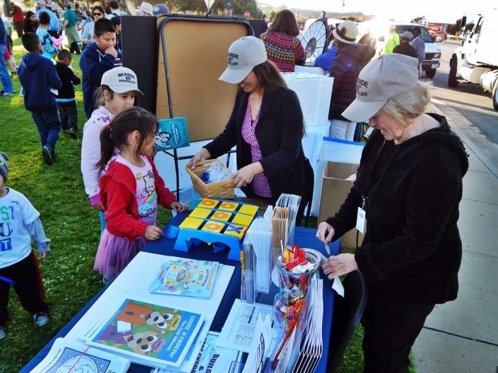 Two Women Working the Kid Booth